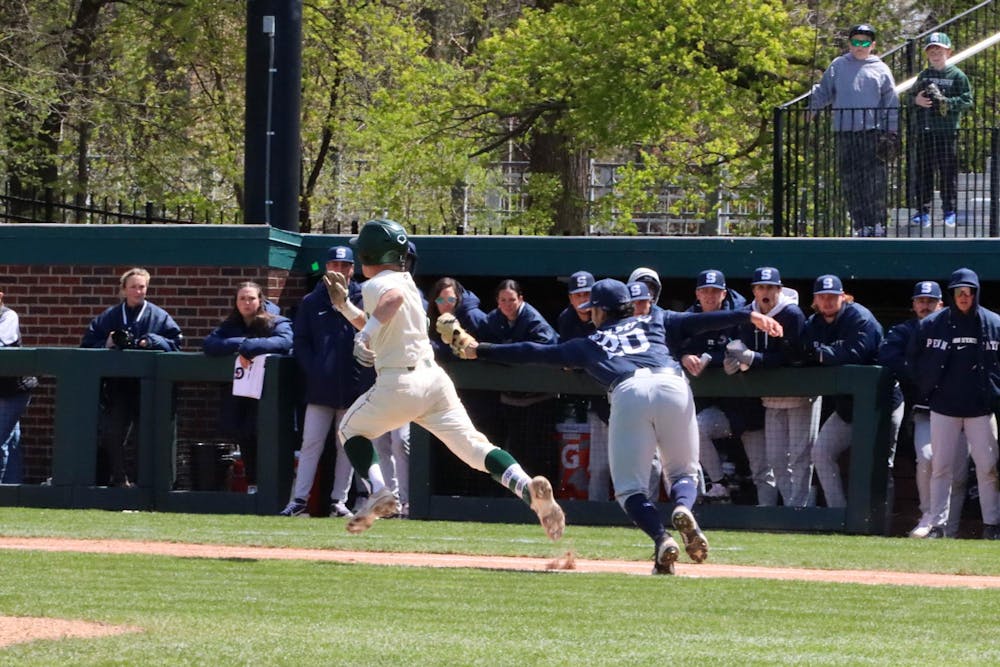 <p>A Penn State first baseman attempts to tap out a Spartan after a successful swing in the matchup against Penn State at McLane Baseball Stadium on April 21, 2024.</p>