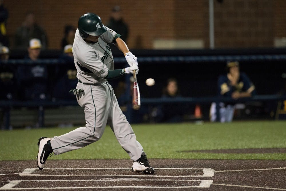 Senior infielder Justin Hovis (8) swings at the ball during the game against Michigan on April 29, 2016 at Ray Fisher Stadium at Wilpon Baseball Complex in Ann Arbor, Mich. The Spartans were defeated by the Wolverines, 4-3.