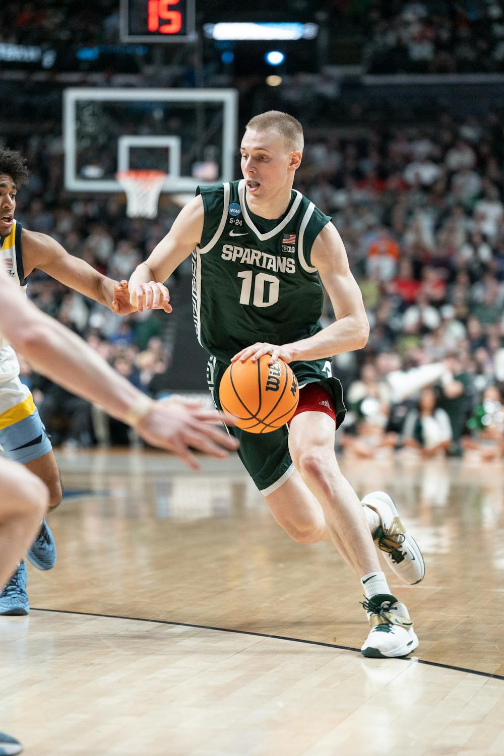 <p>Graduate student guard Joey Hauser drives at Nationwide Arena on March 19, 2023, during the second round of the NCAA tournament. Michigan State defeated Marquette 69-60 to advance to the Sweet 16.</p>