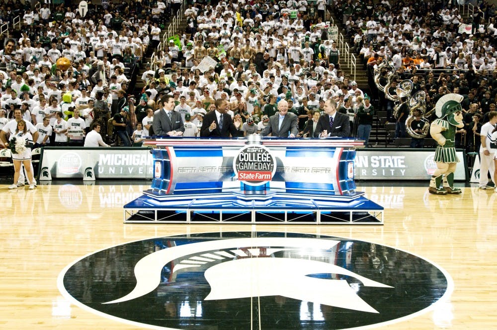 From left, the hosts of ESPN College GameDay Rece Davis, Hubert Davis, Digger Phelps, and Jay Bilas broadcast live Saturday morning at Breslin Center. The show gave Spartan Basketball fans the chance to come out and show the nation they have not given up on their team, despite a less than perfect season. Matt Hallowell/The State News
