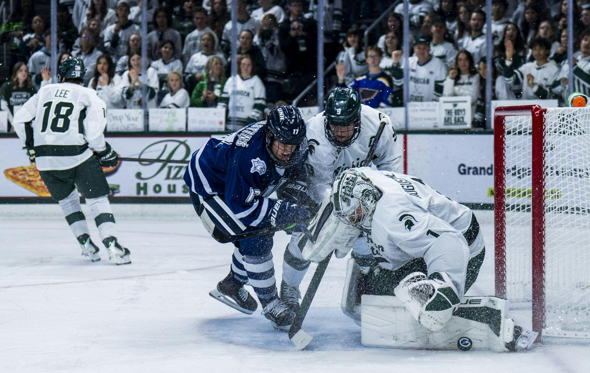 <p>MSU junior goalkeeper Trey Augustine (1) blocks New Hampshire senior forward Kristaps Skrastins (17) in the Munn Ice Arena in East Lansing, Mich. on Oct. 9, 2025.</p>