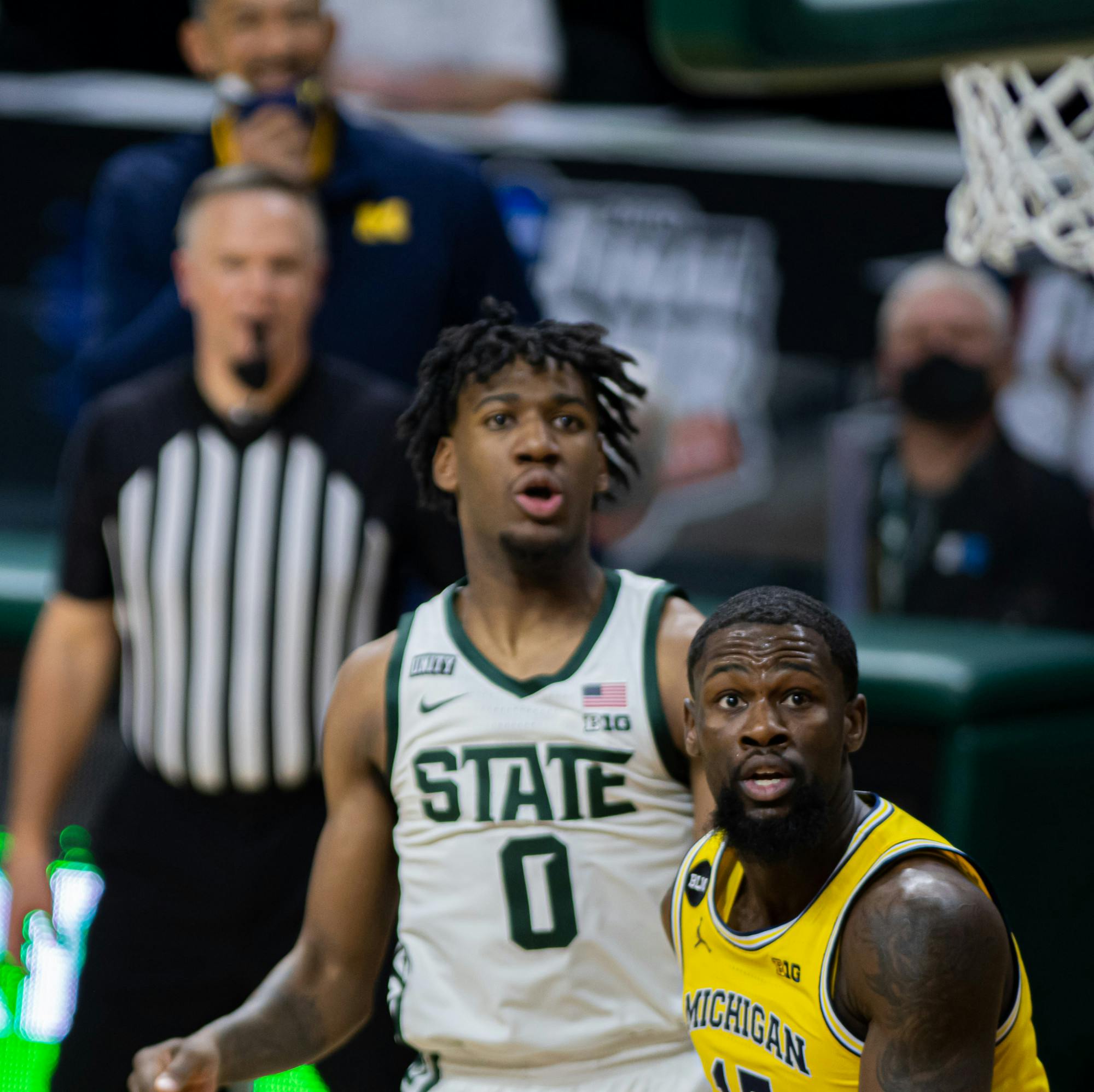 <p>Senior guard Chaundee Brown Jr. and junior forward Aaron Henry watch Henry&#x27;s shot fall into the basket during warmups. The Spartans upset the No. 2 Wolverines 70-64 on March 7, 2021.</p>