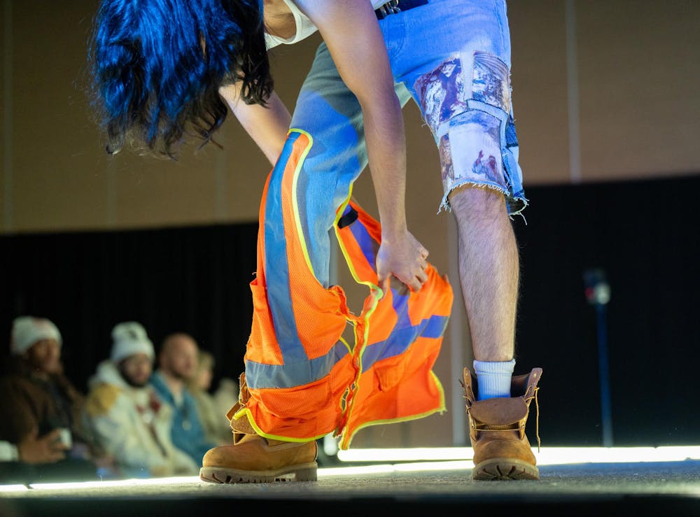 A model poses during N Crowd magazine’s fall fashion show at The Lansing Center on Dec. 8, 2024. N Crowd, a fashion magazine and non-profit organization for creatives at MSU, holds a fashion show every semester.
