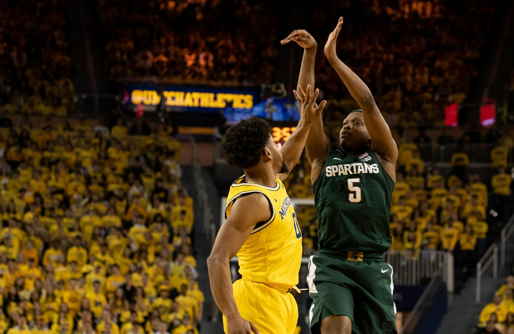 Senior guard Cassius Winston (5) shoots from three during the game against Michigan Feb. 8, 2020 at Crisler Center.