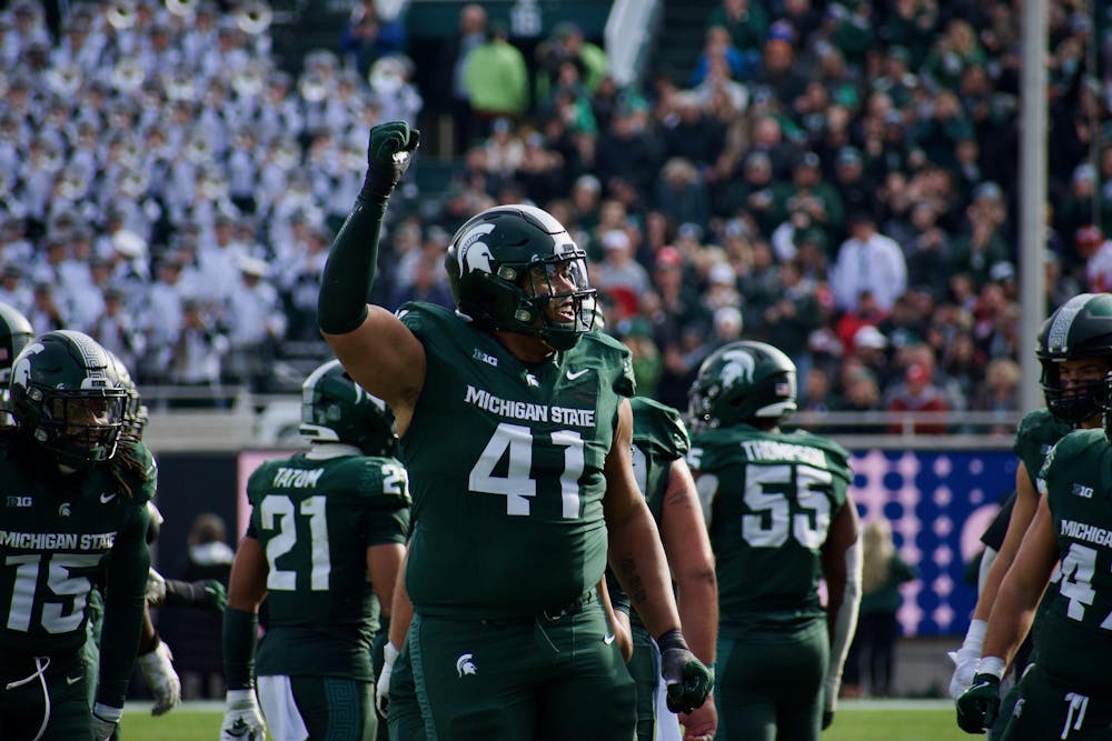 <p>Defensive lineman Derrick Harmon (41) celebrates a play during a game against Nebraska at Spartan Stadium on Nov. 4, 2023. The Spartans defeated the Cornhuskers 20-17.</p>
