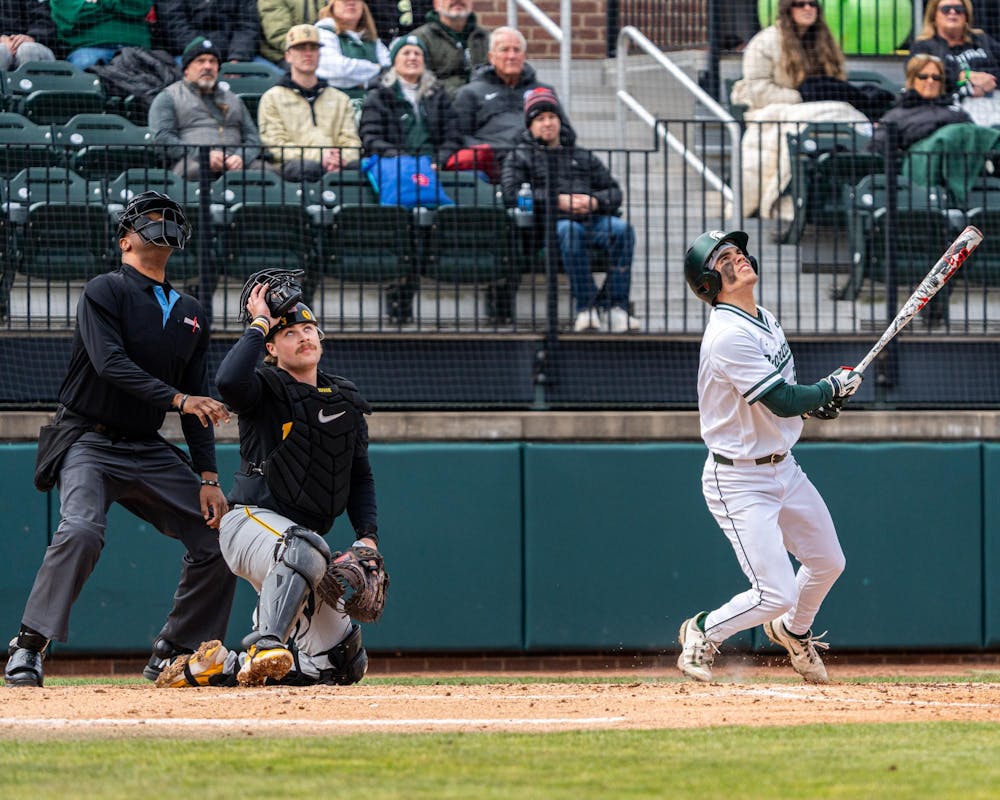 MSU Jr. OF, Trent Rice (5) hots the ball high into the air in the Jeff Ishbia Field in McLane Stadium in East Lansing, MI on March 21, 2026.