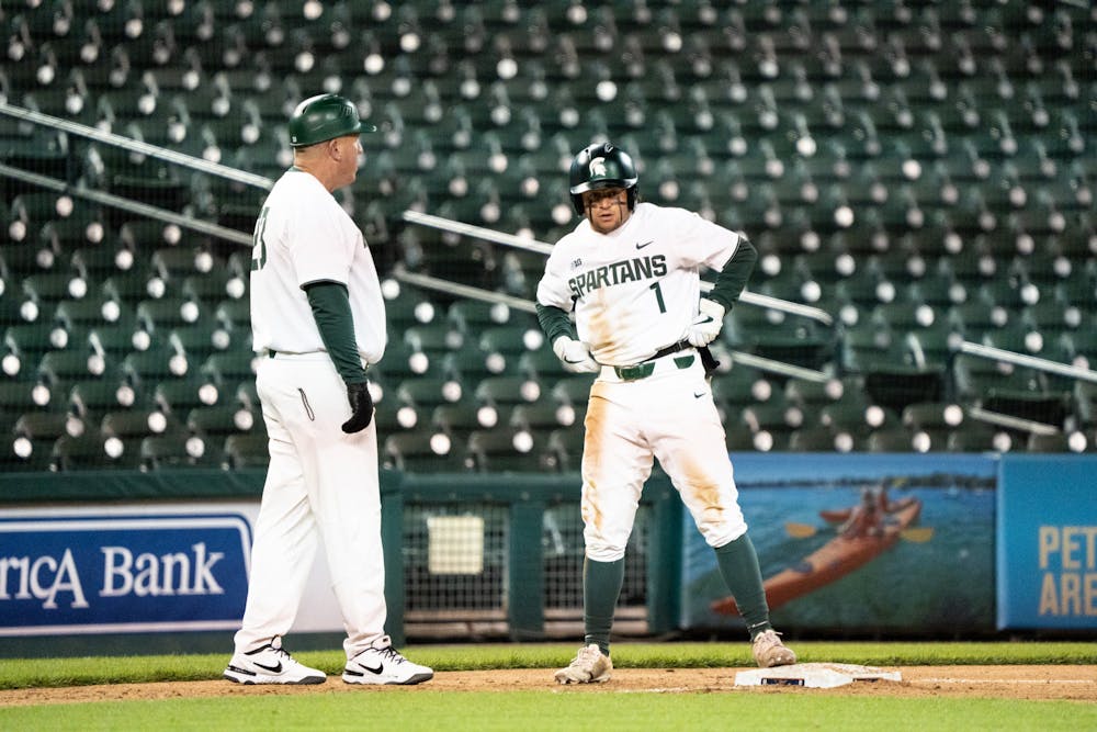 <p>MSU sophomore Trent Farquhar (1) pauses after rushing to third base during the Spartans&#x27; matchup against Notre Dame at Comerica Park on April 26, 2022.</p>