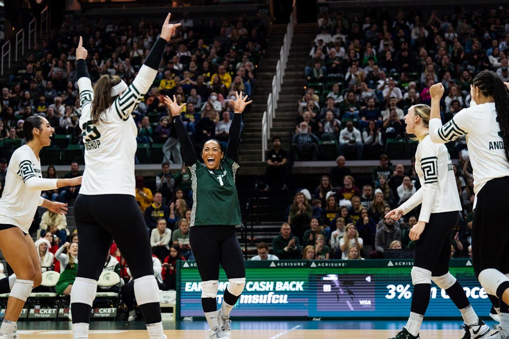 Michigan State celebrates a point against University of Michigan at the Breslin Center on Nov. 15, 2024.