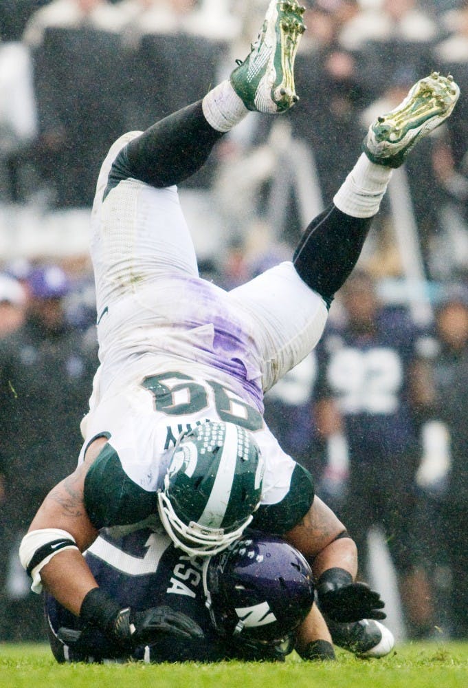 Junior defensive tackle Jerel Worthy Spartan sacks Northwestern quarterback Dan Persa. The Spartans defeated the Wildcats, 31-17, Saturday afternoon at Ryan Field, in Evanston, Ill. Justin Wan/The State News