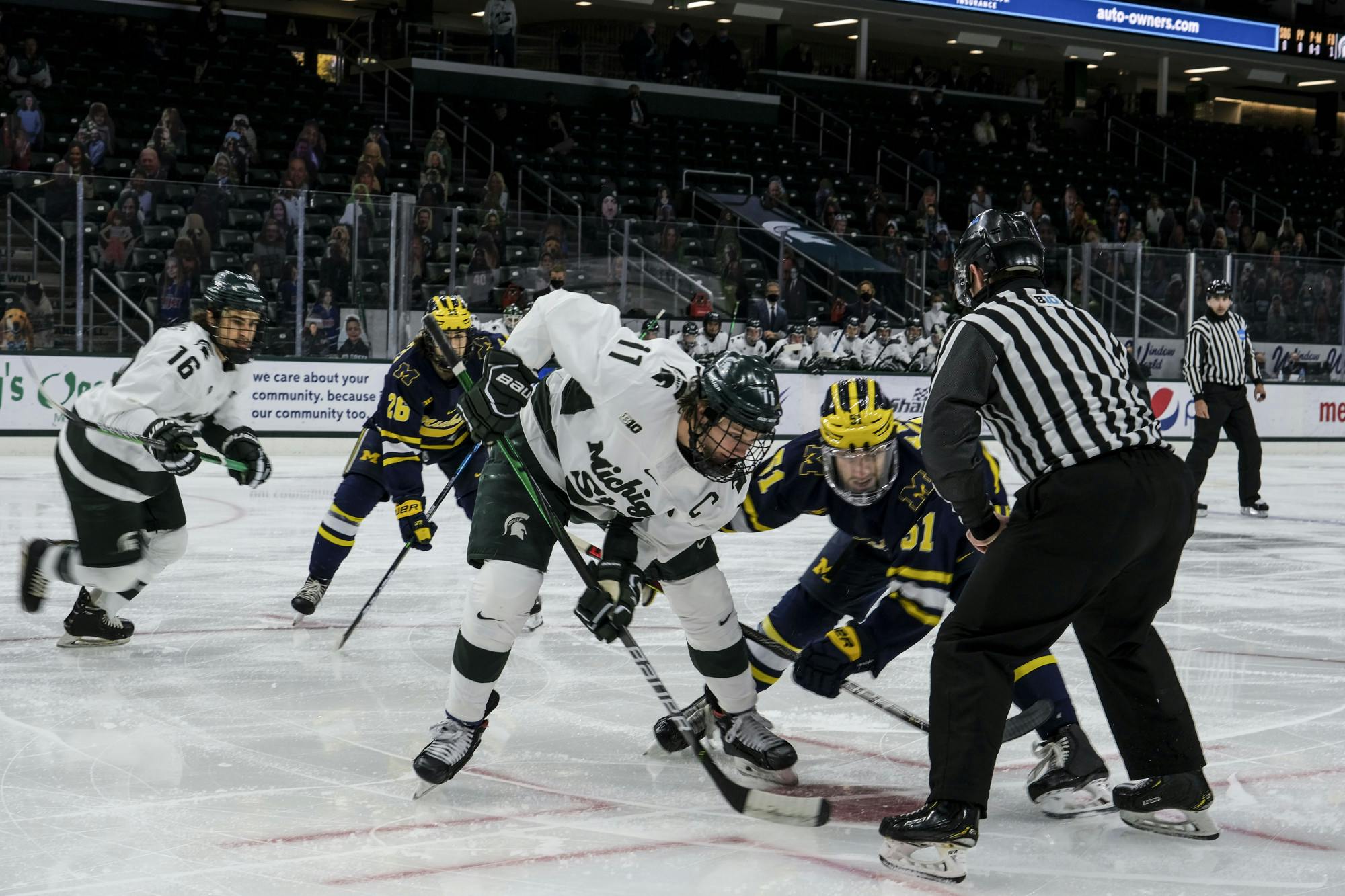 <p>Senior forward Tommy Apap (11) faces off against Michigan on Jan. 9, 2021, at Munn Ice Arena. The Spartans defeated the Wolverines, 3-2. </p>