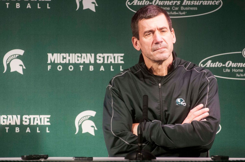 Co-Offensive coordinator Dave Warner listens to a question during a press conference on Dec. 16, 2015 at Spartan Stadium. Members of the coaching staff discussed team preparations for the upcoming Cotton Bowl against Alabama. 