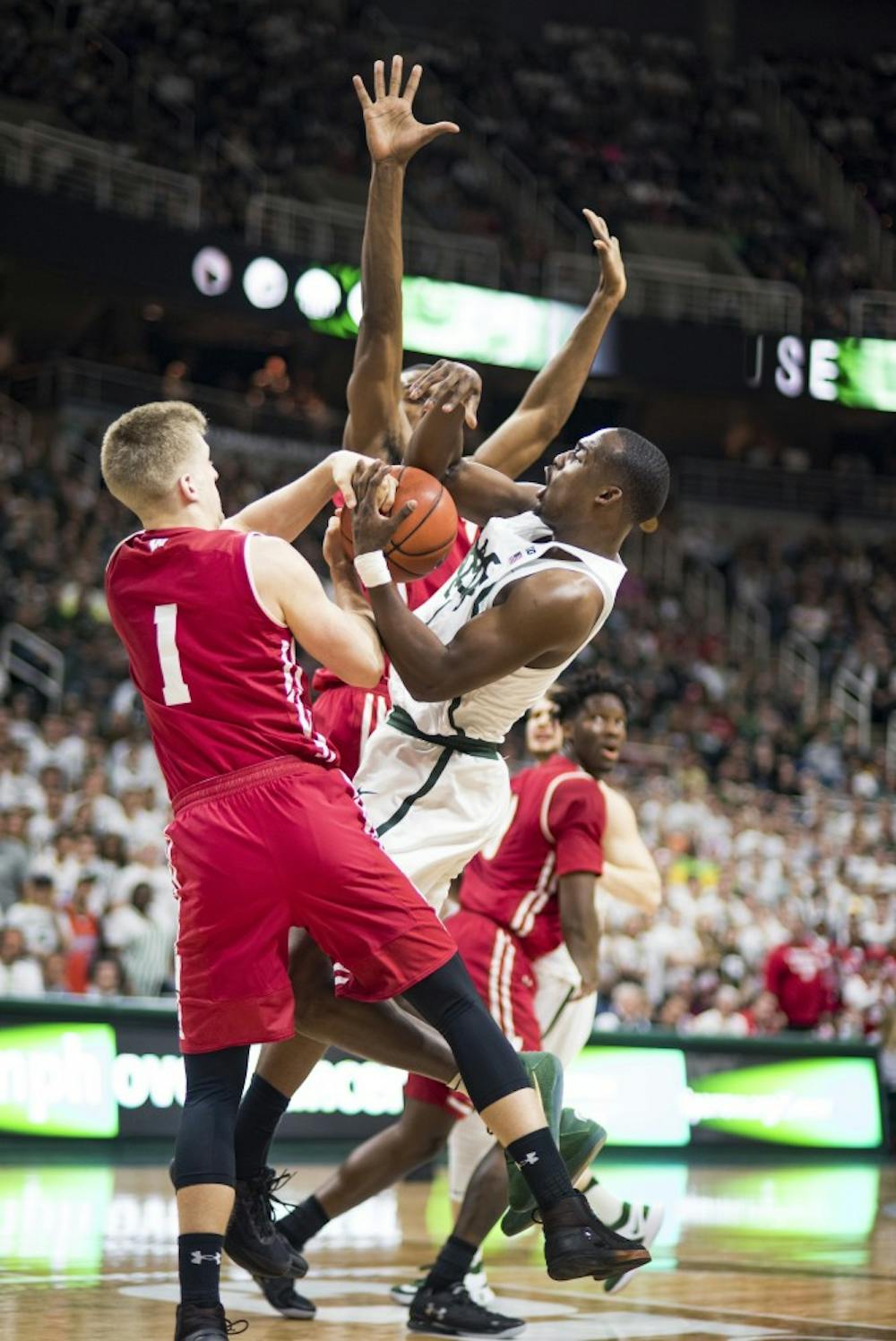 Freshman guard Joshua Langford (1) holds the ball as he is defended by University of Wisconsin guard Brevin Pritzl during the second half of men's basketball game against the University of Wisconsin on Feb. 26, 2017 at Breslin Center. The Spartans defeated the Badgers, 84-74.