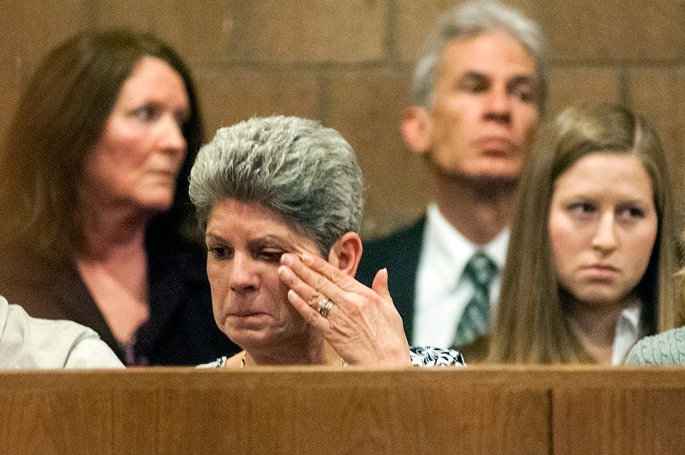 	<p>New Boston, Mich., resident Susan Singler, aunt of victim Andrew Singler, wipes away tears during the preliminary exam for the teen accused of the fatal stabbing of <span class="caps">MSU</span> student Andrew Singler on April 18, 2013, at Ingham County District Judge Donald Allen&#8217;s courtroom in Mason, Mich. Natalie Kolb/The State News</p>
