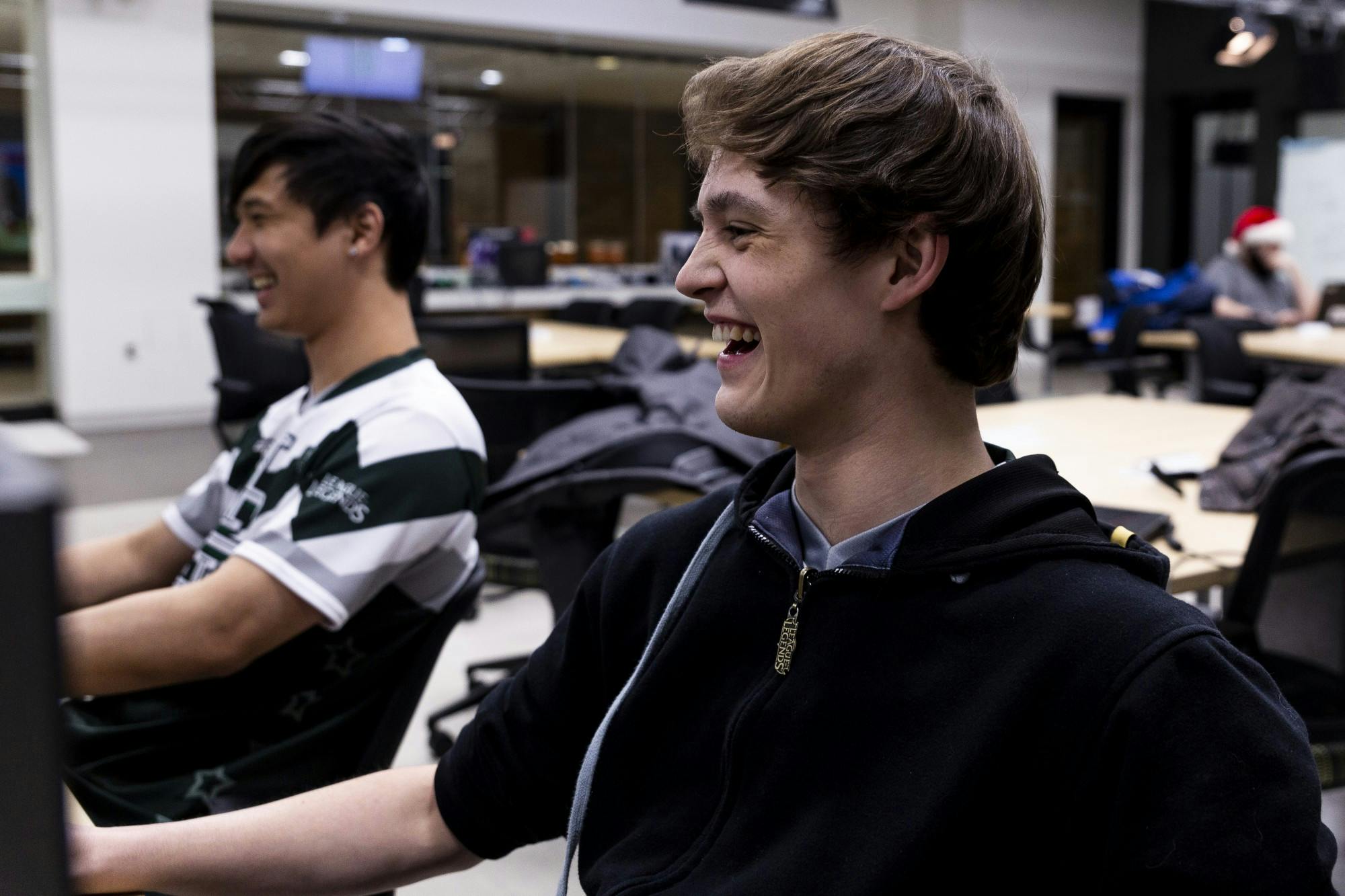 <p>Ryan Felten laughs with teammates while playing League of Legends on Dec. 2, 2019 at Communication Arts Building. </p>