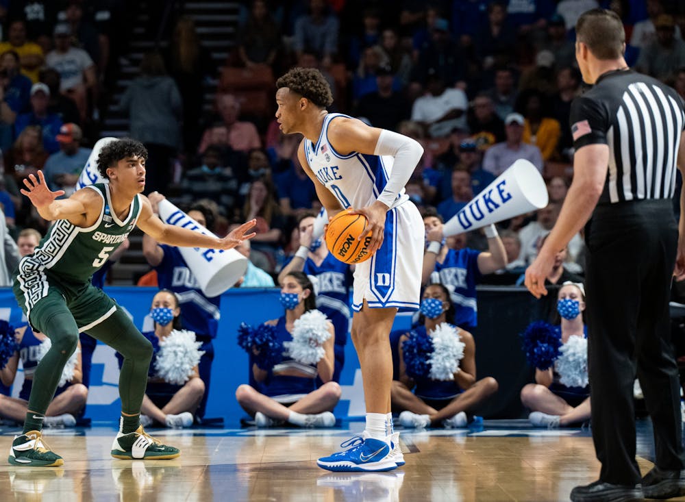<p>Freshman guard Max Christie (5) defends against junior forward Wendell Moore Jr. (0) during Duke&#x27;s victory over Michigan State on March 20, 2022.</p>