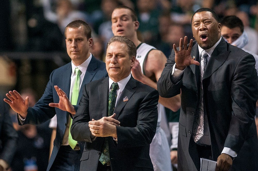 	<p><span class="caps">MSU</span> coaches, from left, assistant coach Dane Fife, head coach Tom Izzo, and assistant head coach Dwayne Stephens react in the third round of the <span class="caps">NCAA</span> Tournament. The Spartans defeated Memphis, 70-48, Saturday, March 23, 2013, at The Palace of Auburn Hills in Auburn Hills, Mich. Justin Wan/The State News</p>