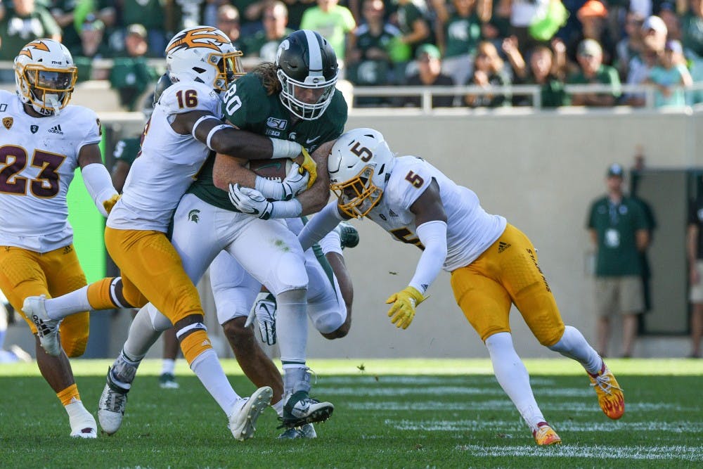 <p>Redshirt senior tight end Matt Seybert (80) runs upfield after a catch during the game against Arizona State on Sept. 14, 2019 at Spartan Stadium. The Spartans fell to the Sun Devils, 10-7.</p>