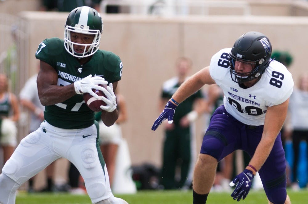 <p>Running back Weston Bridges (27) runs with the ball during the game on Oct. 26, 2018 at Spartan Stadium. The Wildcats defeated the Spartans, 29-19.</p>