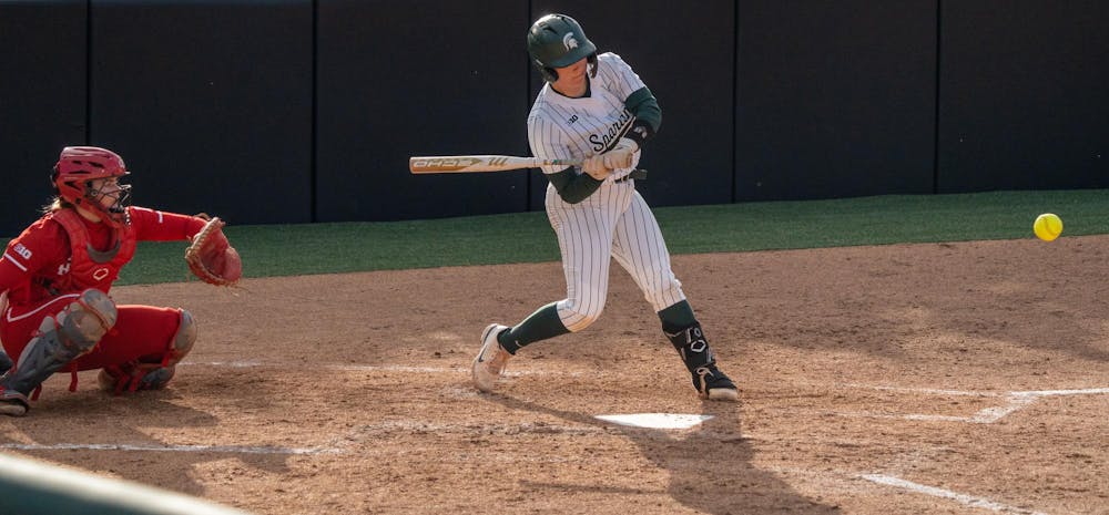 <p>A Michigan State University softball player gets ready to swing as the ball comes in during the Spartans' matchup against Indiana Hoosiers at Secchia Stadium on April 5, 2024.</p>