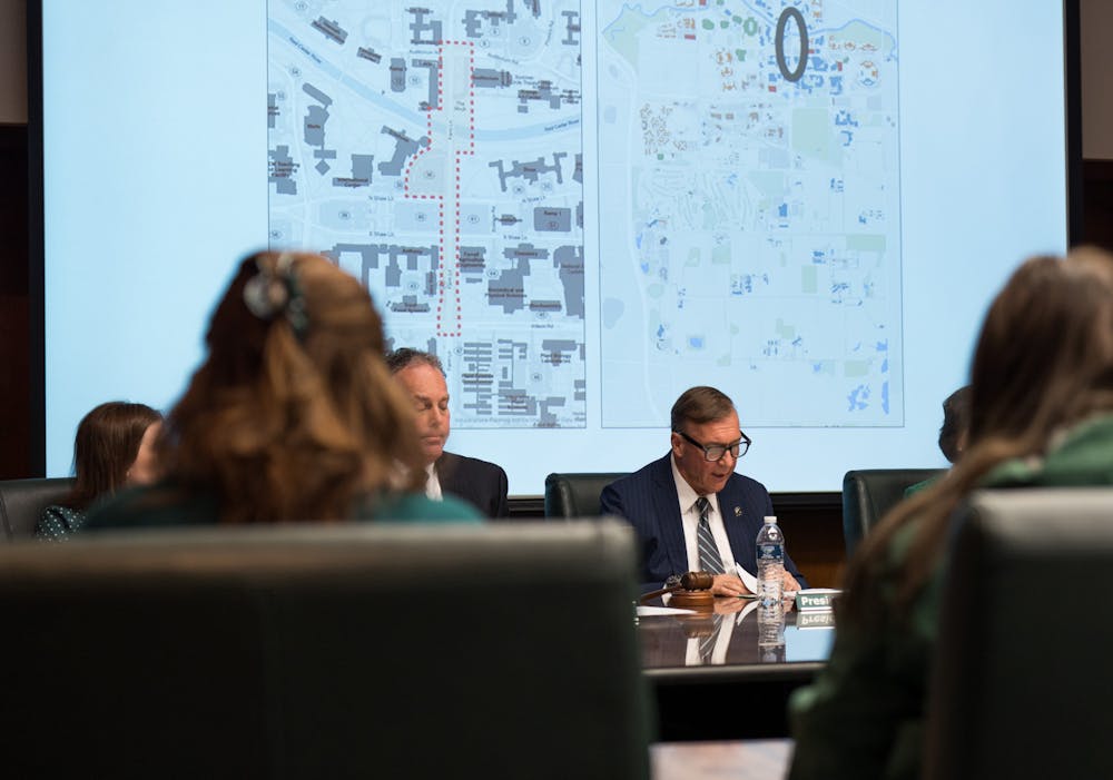 Michigan State President Samuel L. Stanley discussing the authorization to plan Farm Lane Bridge replacements and infrastructure improvements. The Michigan State University Board of Trustees met in the Hannah Administration Building, on April 22, 2022.
