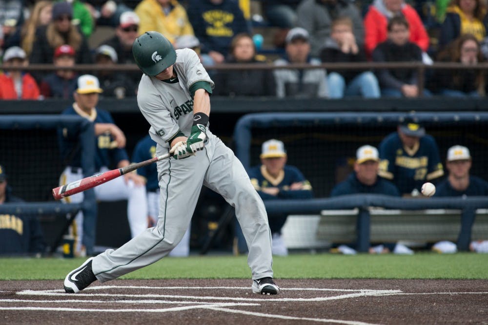 Junior infielder Jordan Zimmerman (5) swings at the ball during the game against Michigan on April 29, 2016 at Ray Fisher Stadium at Wilpon Baseball Complex in Ann Arbor, Mich. The Spartans were defeated by the Wolverines, 4-3.