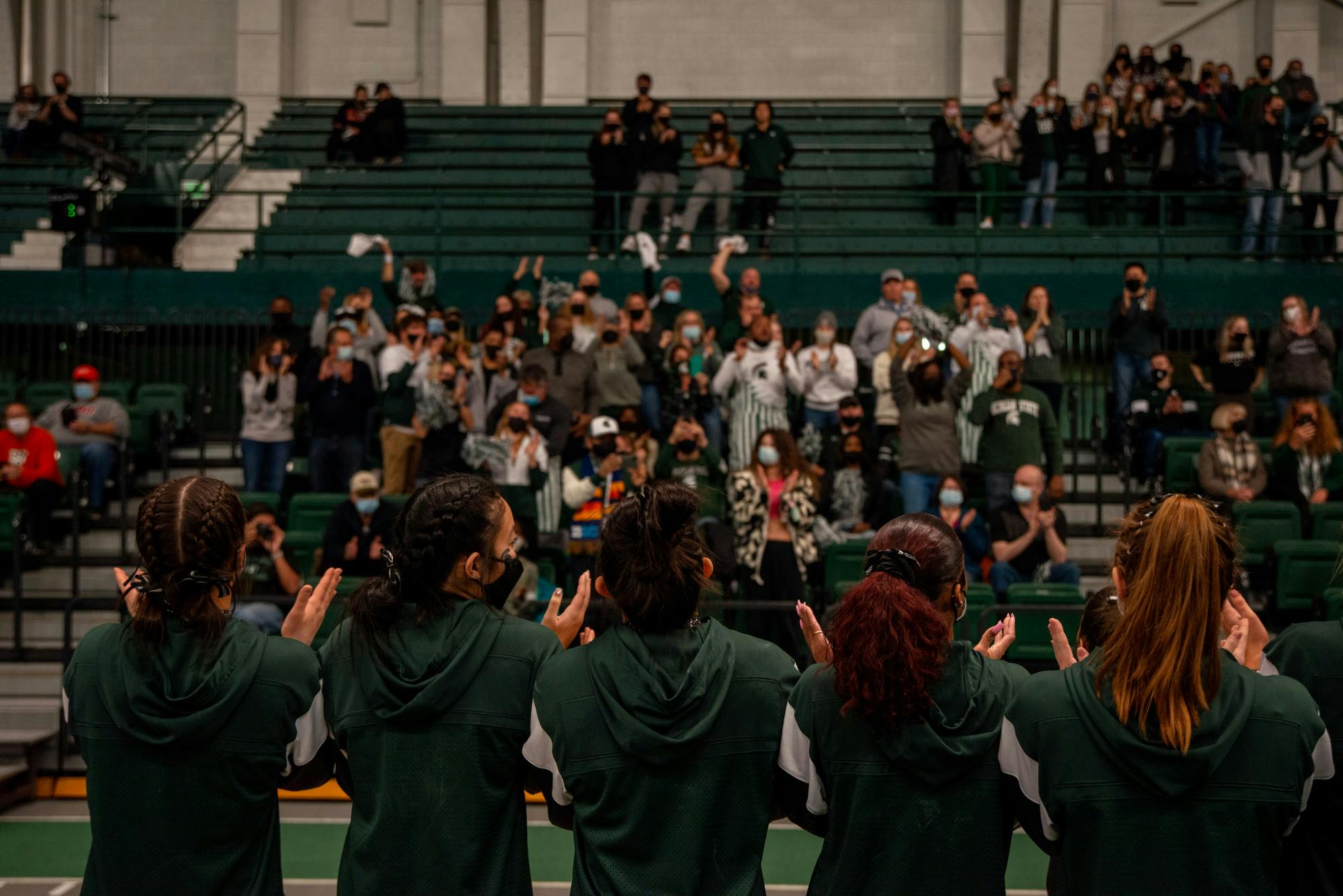 <p>The MSU Women&#x27;s Gymnastics team receives applause from the crowd after their win at Jenison Field House on Jan. 15, 2022.</p>