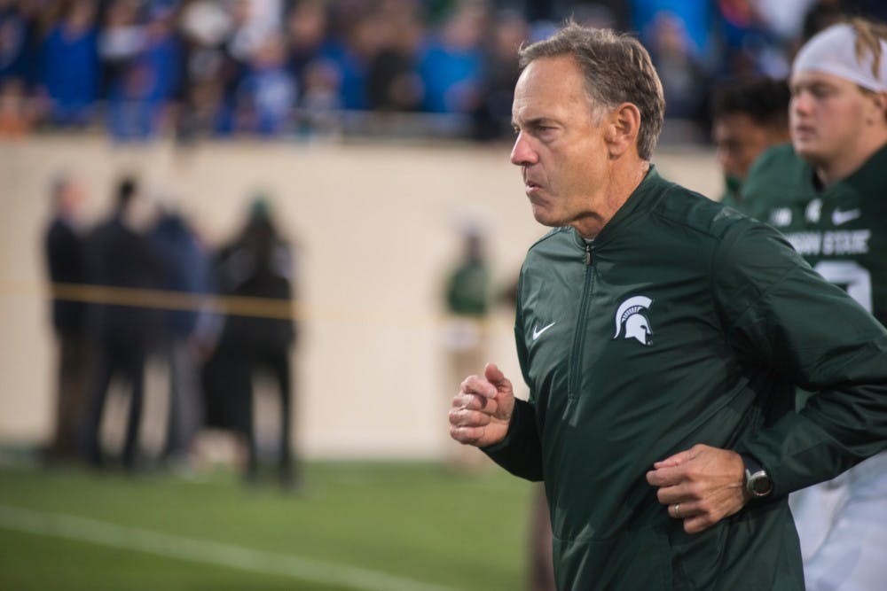 Head coach Mark Dantonio runs off the field after the game against Brigham Young University on Oct. 8, 2016 at Spartan Stadium. The Spartans were defeated by the Cougars, 31-14.