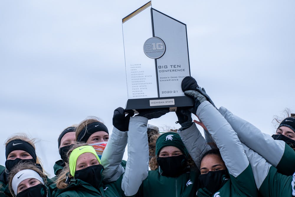 <p>Michigan State women&#x27;s cross country hoists their Big Ten Title after winning the Cross Country Big Ten Championship on Jan. 30, 2021.</p>