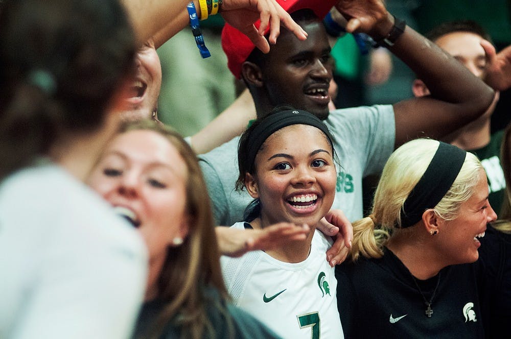 	<p>Junior defensive specialist Ryian Hubbard celebrates with the student section after winning the game against Oregon, Sept. 6, 2013, at Jenison Field House. The Spartans defeated Oregon, 3-1. Danyelle Morrow/The State News</p>