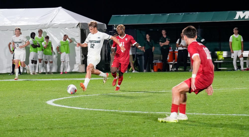 <p>Midfielder Cristiano Bruletti kicked the ball away from opponents during the game against Indiana University at DeMartin Soccer Field on Sept. 22, 2023.</p>