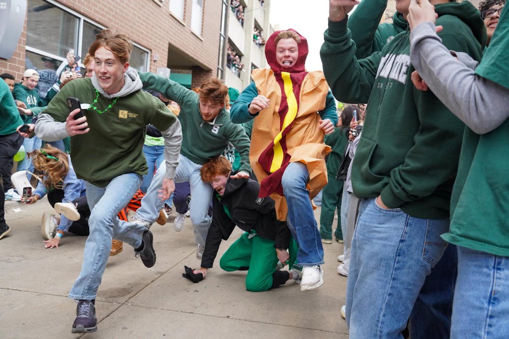 Michigan State University students participate in downtown East Lansing, Mich., for the Ginger Run on Saturday, March 14, 2026.