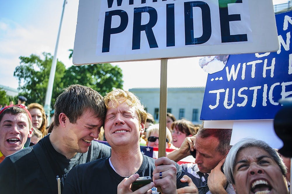 	<p>Michael Knaapen, left, and his husband John Becker embrace outside the Supreme Court after hearing that the Court struck down the Defense of Marriage Act, Wednesday, June 26, 2013, in Washington, D.C. (Pete Marovich/MCT)</p>