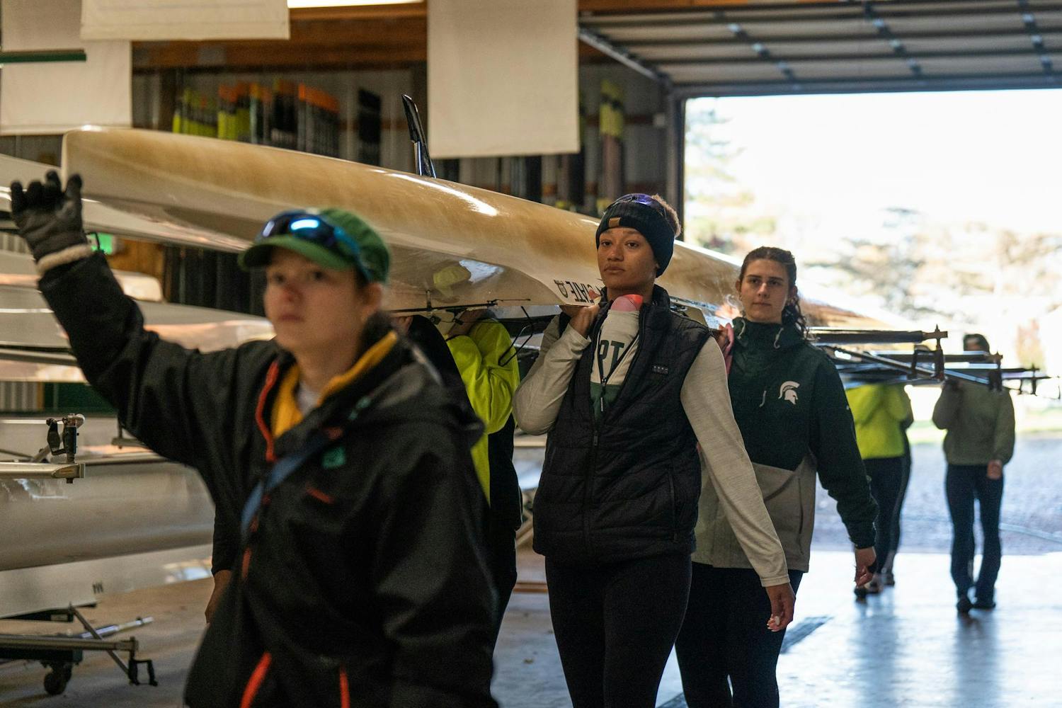 Man Rowing Boat Phot Michigan State Rowing returns after a morning outing on the Grand River ...
