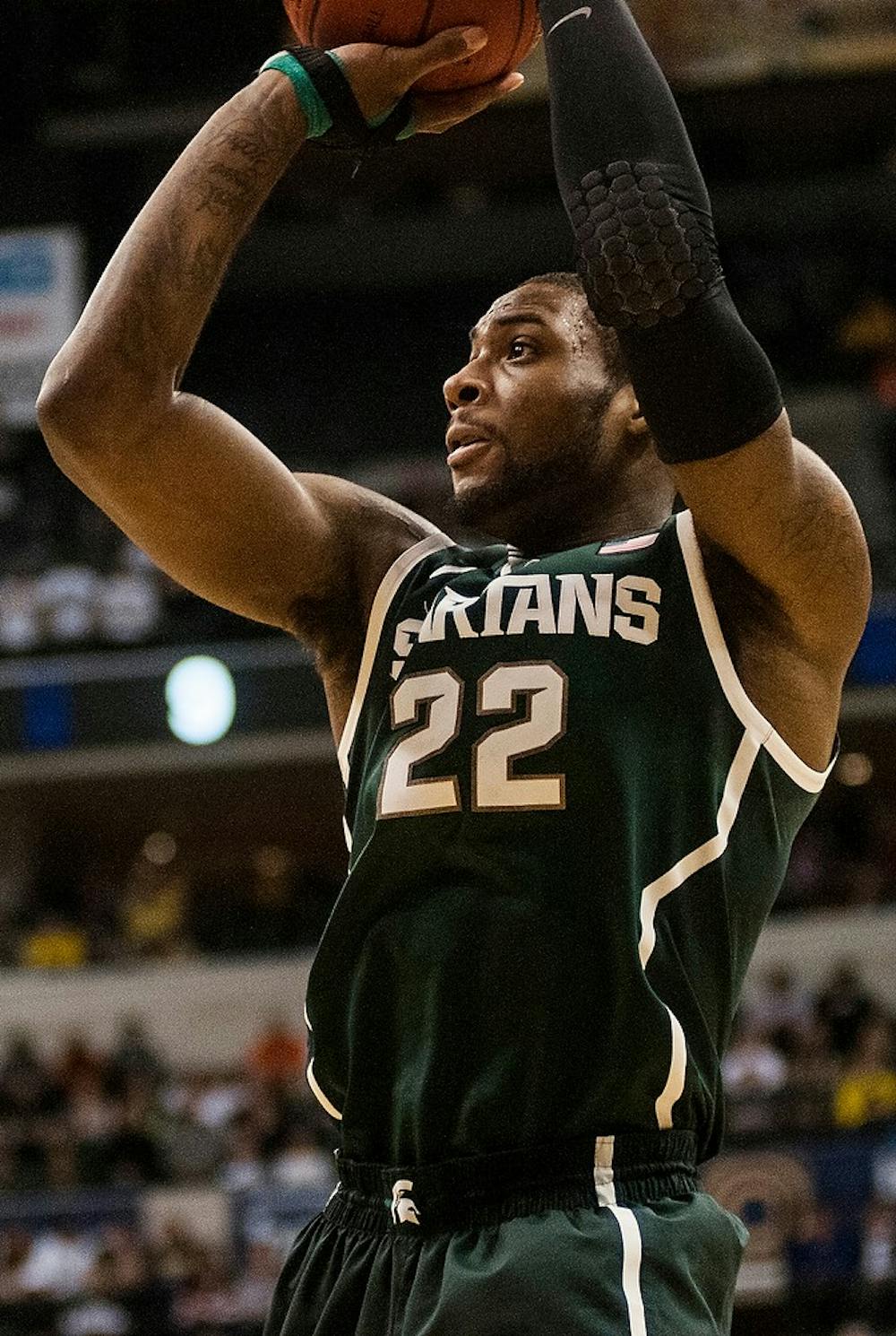 <p>Junior forward Branden Dawson shoots March 16, 2014, during the game against Michigan at the Big Ten Championship at Bankers Life Fieldhouse in Indianapolis. The Spartans defeated the Wolverines, 69-55. Erin Hampton/The State News</p>