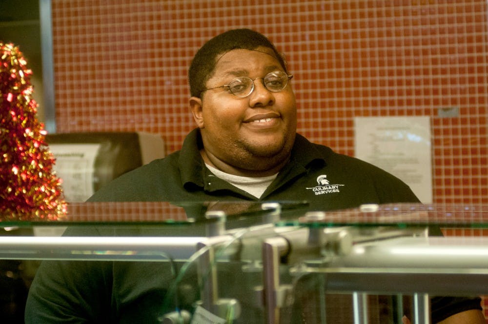 <p>East Lansing resident Walter Hutchinson serves meals to students Nov. 26, 2014, at The Vista at Shaw. Hutchinson is currently homeless so the Iota Phi Theta fraternity started a fundraiser on GoFundMe to raise money to get him a car. Raymond Williams/The State News</p>