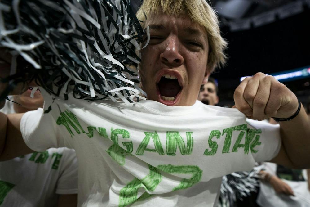 A Michigan State fan cheers during a match at the Breslin Center in East Lansing, Mich., on Friday, Sept. 2026.