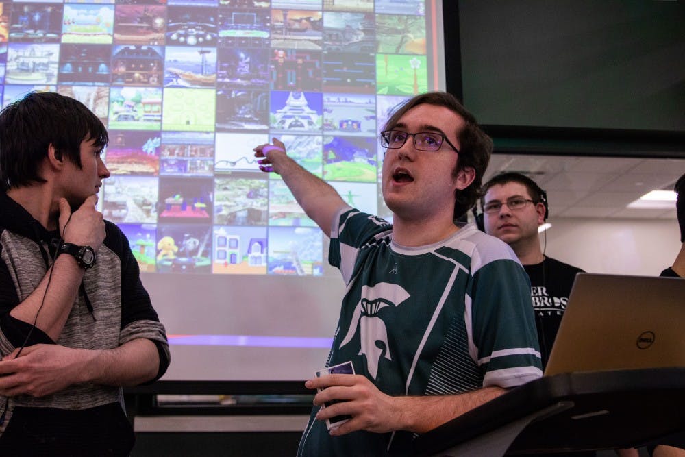 MSU Smash Ultimate Club treasurer Samuel "Azura" Richardson talks to the group at the club's weekly tournament April 5 at the Communication Arts and Sciences Building.
