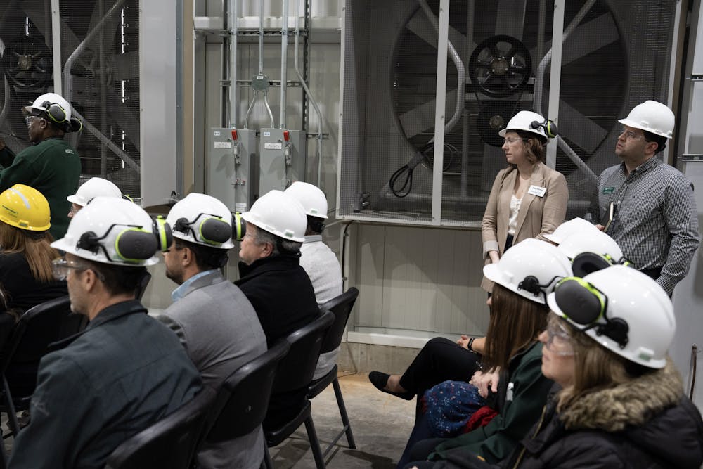 <p>University administrators and Consumers Energy executives listen to Interim-President Teresa Woodruff speak in MSU's Simon Power Plant at a media event on March 20th, 2023.</p>
