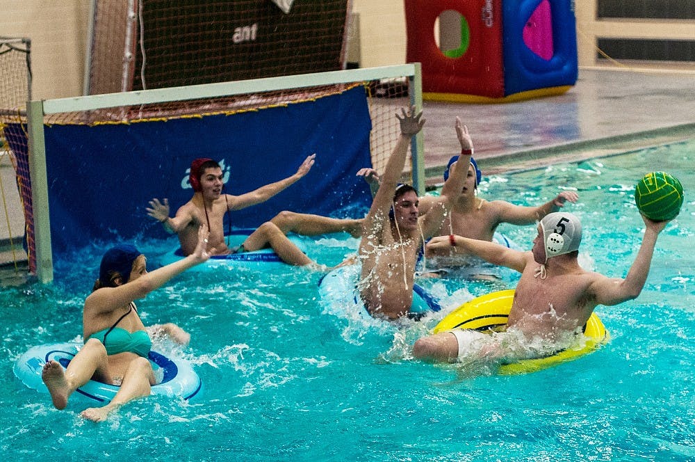 	<p>Students participate in a water polo tournament Jan. 31, 2014, at a <span class="caps">UAB</span> event at IM Circle. The event had Maui Wowi smoothies, a raffle, free snapbacks and candy. Erin Hampton/The State News</p>