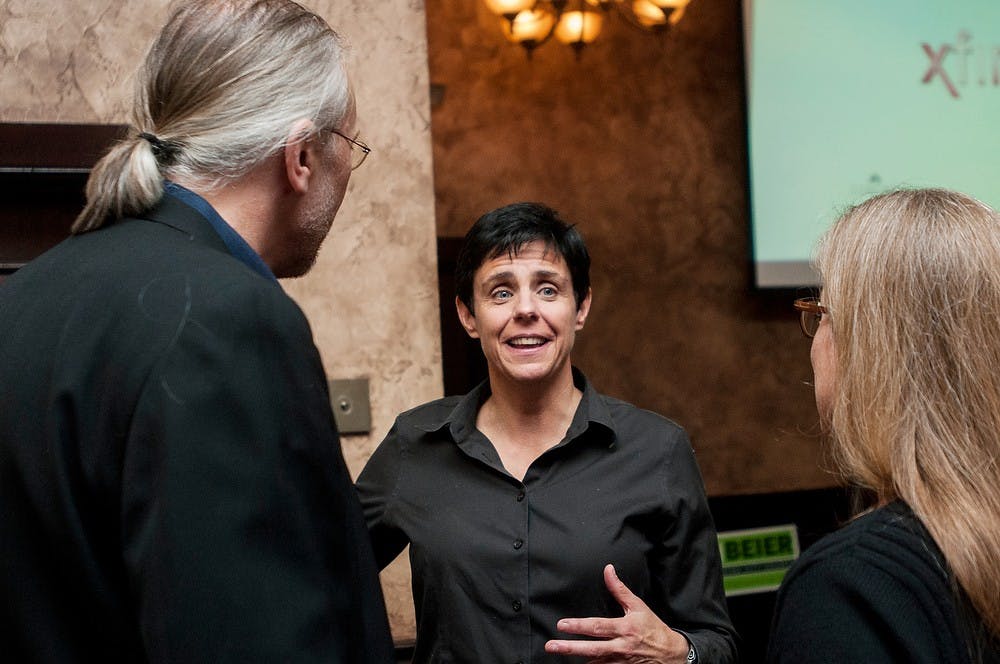 	<p>East Lansing City Council candidate Ruth Beier interacts with her supporters as she awaits the poll results on Nov. 5, 2013, at Dublin Square. Beier, an <span class="caps">MSU</span> alumna, won her election for a four-year term. Khoa Nguyen/The State News</p>