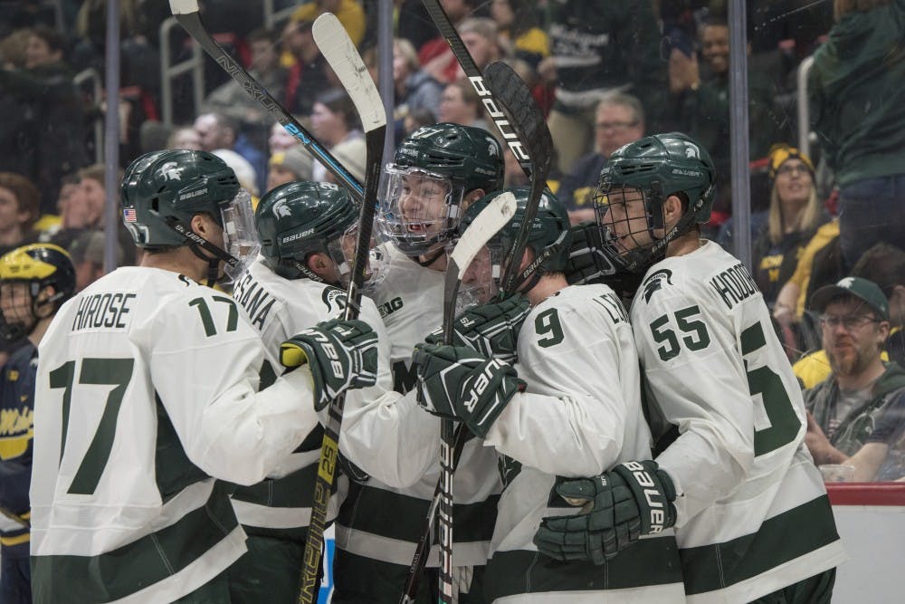 The Spartans celebrate a goal during the Duel in the D at Little Caesars Arena in Detroit on Feb. 9, 2019. Michigan defeated Michigan State 5-2. Nic Antaya/The State News