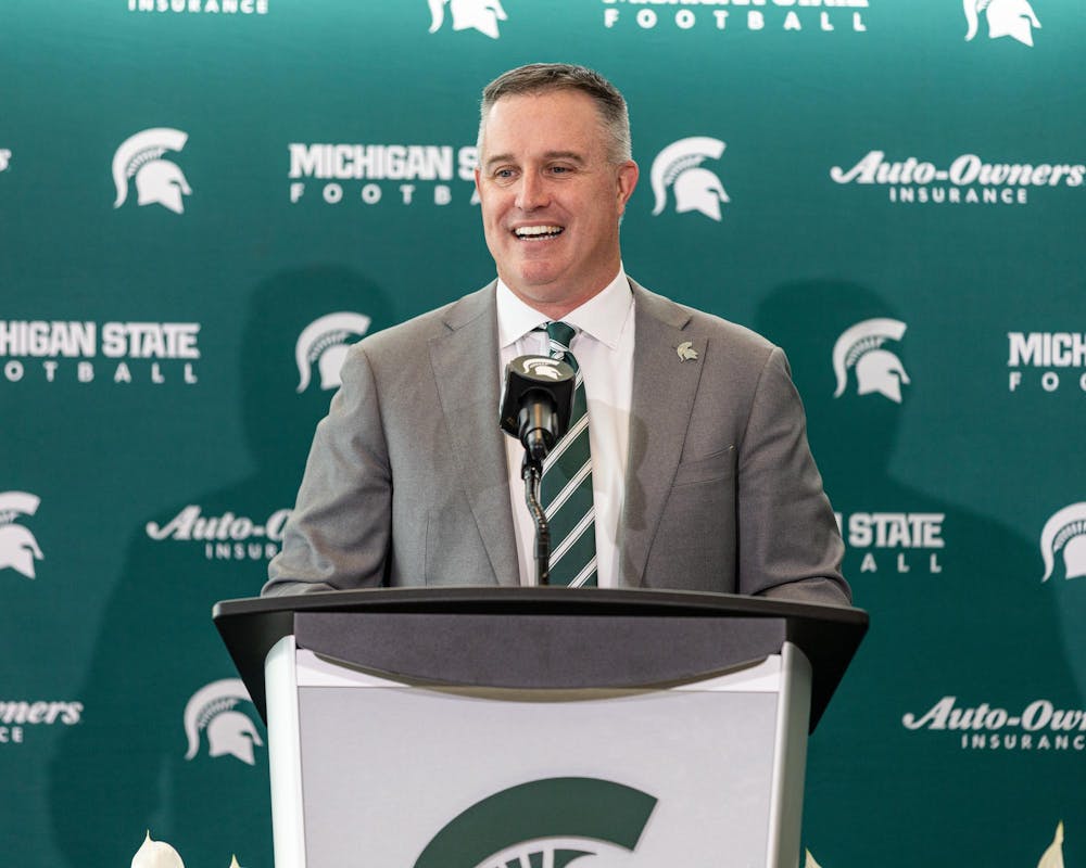 MSU's new football HC Pat Fitzgerald smiles to the crowd in the Tom Izzo football building in East Lansing, MI on Dec. 2, 2025.