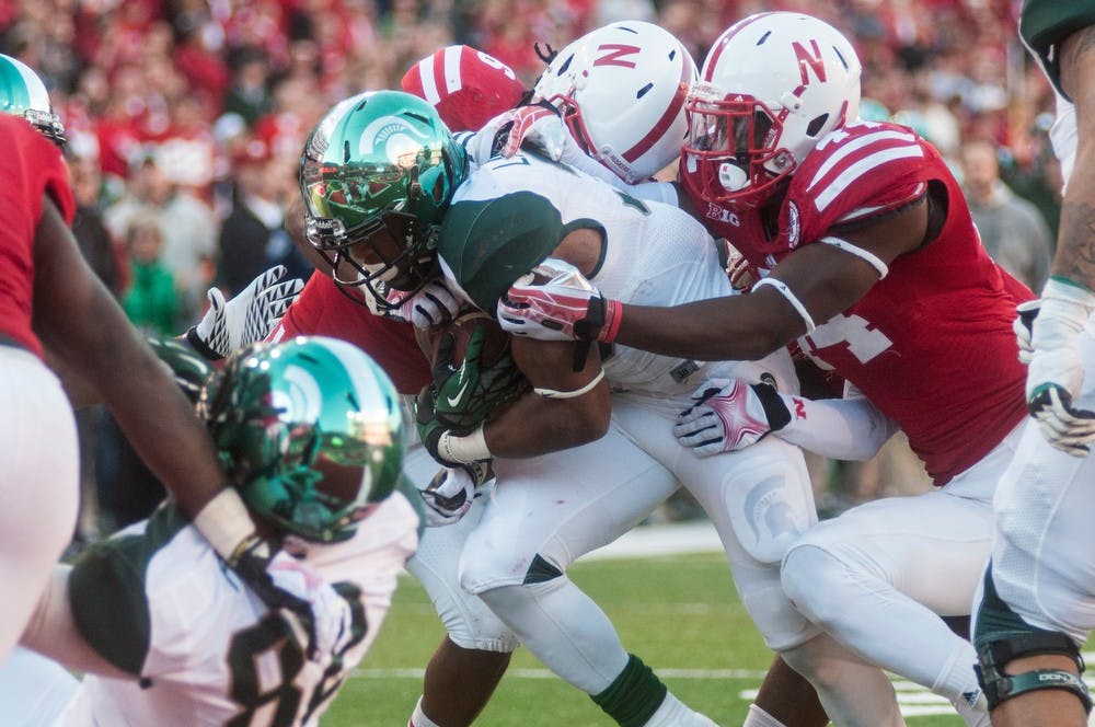 	<p>Junior runningback Jeremy Langford runs the ball into the endzone during the game against Nebraska on Nov. 16, 2013, at Memorial Stadium in Lincoln, NE. The Spartans beat the Cornhuskers, 41-28. Khoa Nguyen/The State News</p>