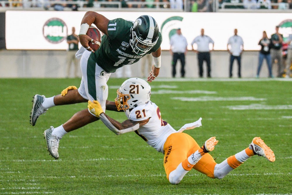 <p>Then-junior running back Connor Heyward (11) is tackled during the game against Arizona State on Sept. 14, 2019 at Spartan Stadium. The Spartans fell to the Sun Devils, 10-7.</p>
