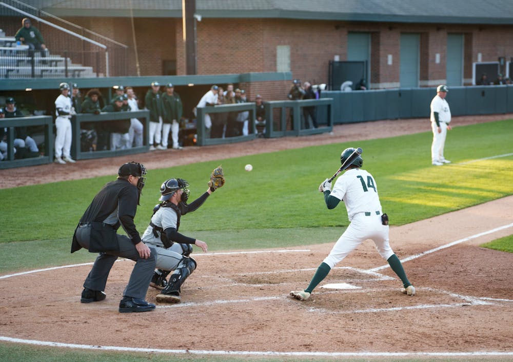 Michigan State sophomore infielder Mitch Jebb (14) walking after a fourth ball in the bottom of the fourth. Michigan State won 7-4 against Purdue Fort Wayne at the McLane Stadium, on Apr. 27, 2022.