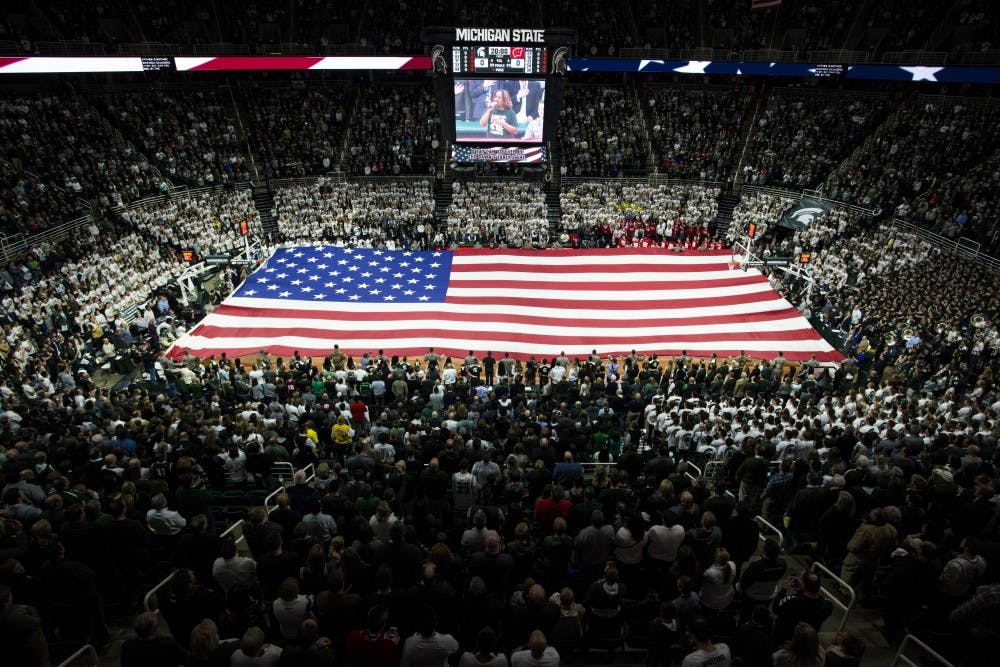 The Spartan ROTC Cadets hold out the flag during the national anthem before the first half of the men's basketball game against the University of Wisconsin on Feb. 26, 2017 at Breslin Center. The Spartans defeated the Badgers, 84-74.
