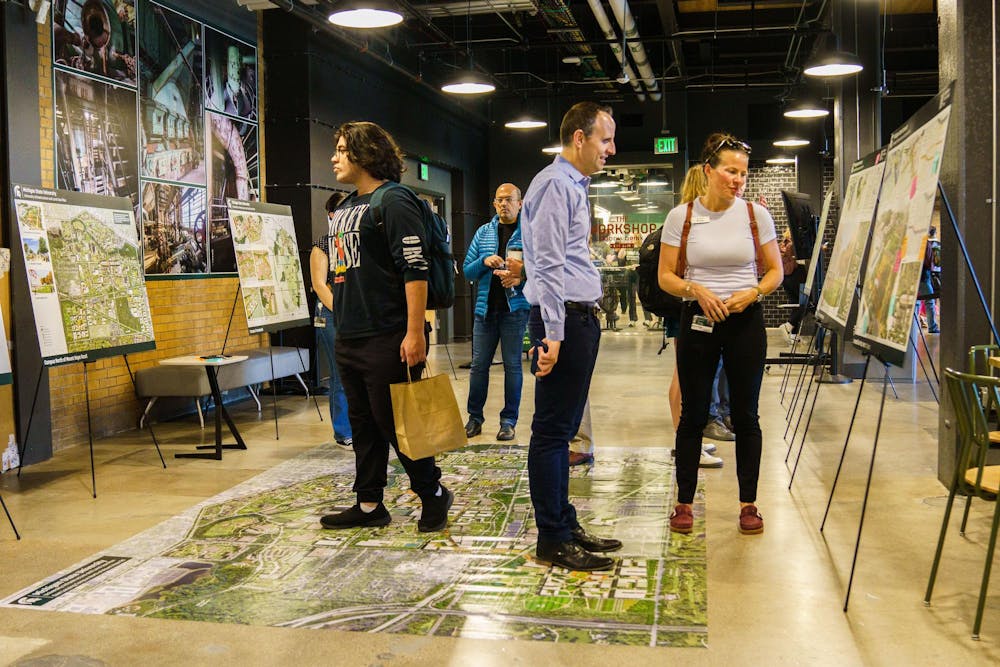 Visitors learn about future development plans for the MSU campus at an open house event, hosted by the Facilities and Land Use Plan team at the STEM Teaching and Learning Facility on April 12, 2023.