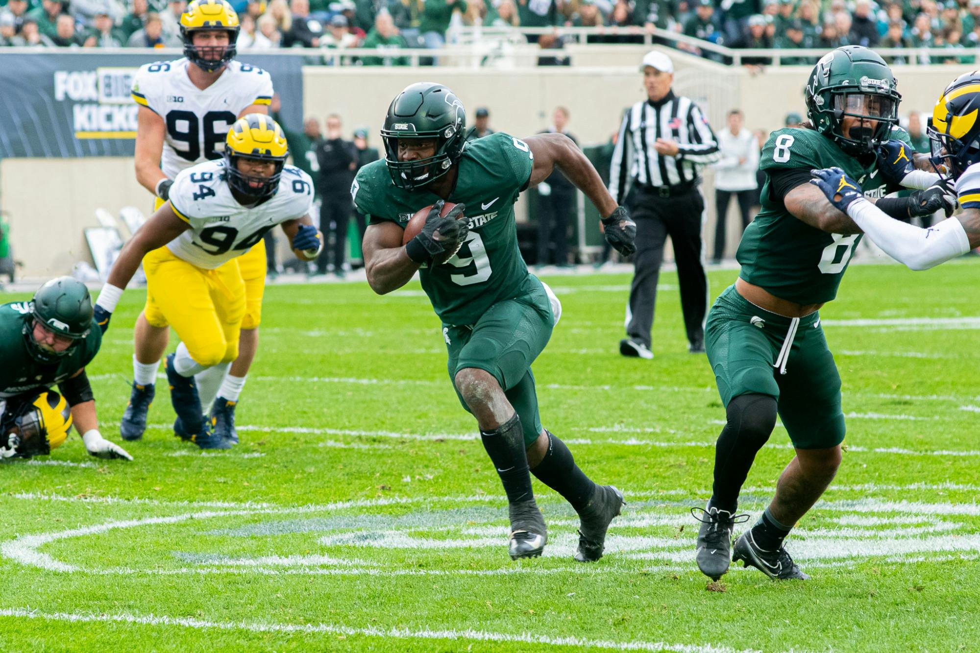 <p>Junior running back Kenneth Walker III finds a seam and scores the Spartans&#x27; first touchdown of the day against the Wolverines on Oct. 30, 2021.</p>