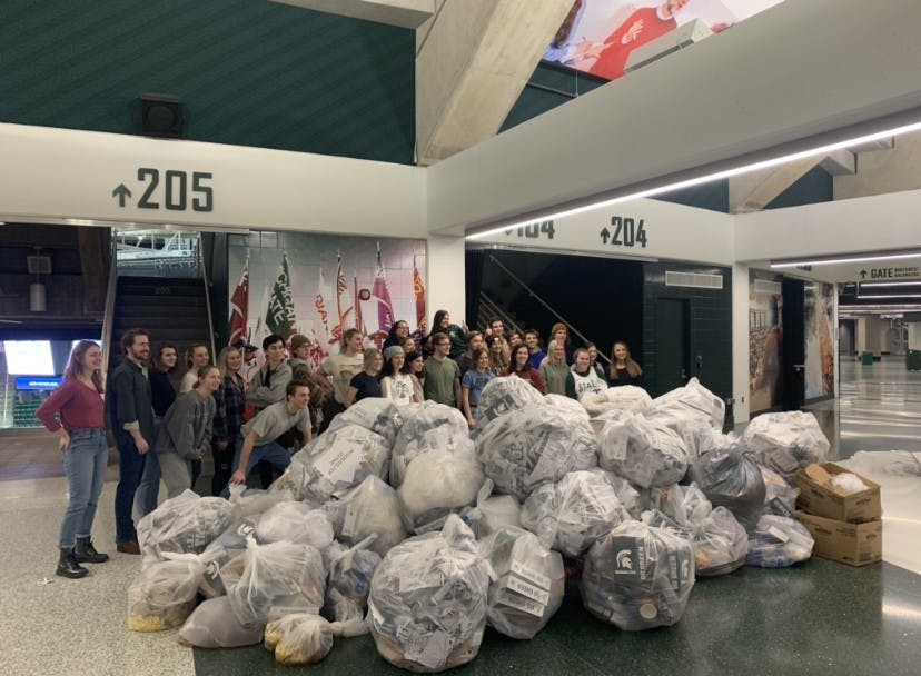 <p>Volunteers pose with the collected bags of recyclables and compost after the Breslin Recycling Sweep on Jan. 29. </p>