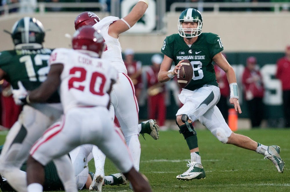 <p>Then senior quarterback Connor Cook looks to pass during the game against Indiana on Oct. 24, 2015, at Spartan Stadium. The Spartans defeated the Hoosiers, 52-26.</p>